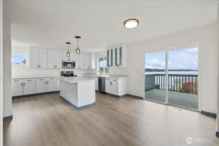 Easy access from the front deck to this dreamy fully renovated kitchen with brand new appliances, cabinets and countertops.