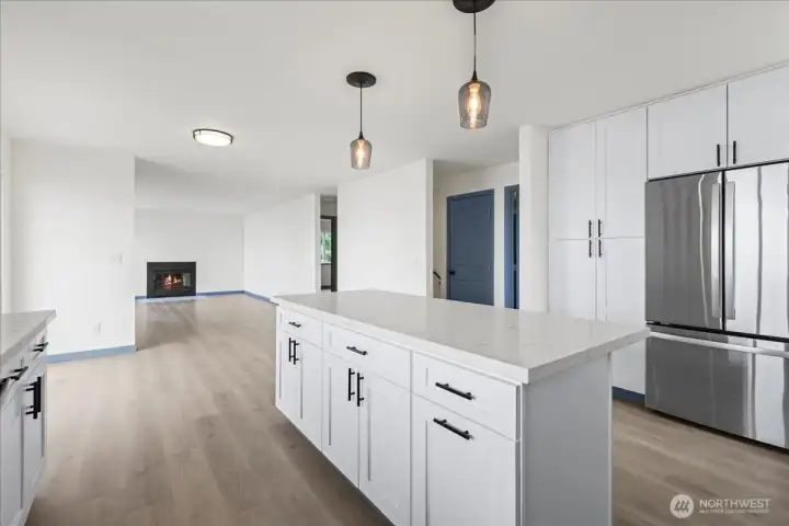 Featuring a full floor to ceiling pantry, this kitchen has all of the storage and counterspace you could ask for!