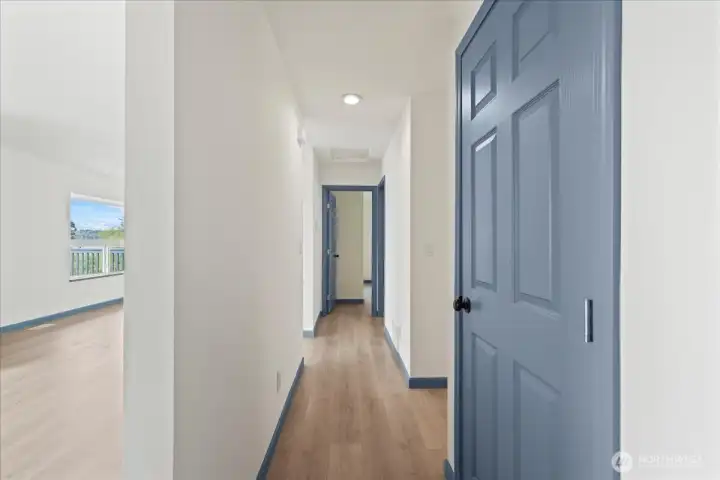 Hallway to the bedrooms, linen closet, bathroom and stairway
