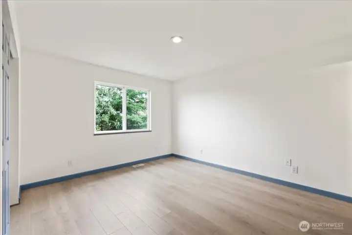 Primary bedroom, large enough for a King bed.