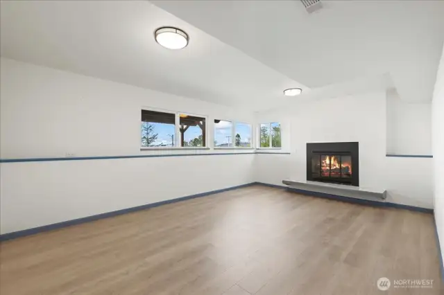 Family room, enough room for just about anything you'd want in here. Fitness room, dual offices, playroom, TV room, library....dream on my friend! The view from here is also unbeatable. Also has a wood burning fireplace.