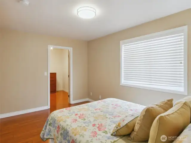 Desirable main floor bedroom with walk-in closet and ensuite bathroom, privacy for family members or guests.