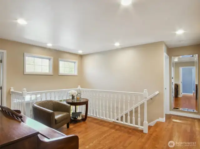 The second-floor landing is designed to maximize light flow, creating a bright and spacious feel that permeates the entire upper level.