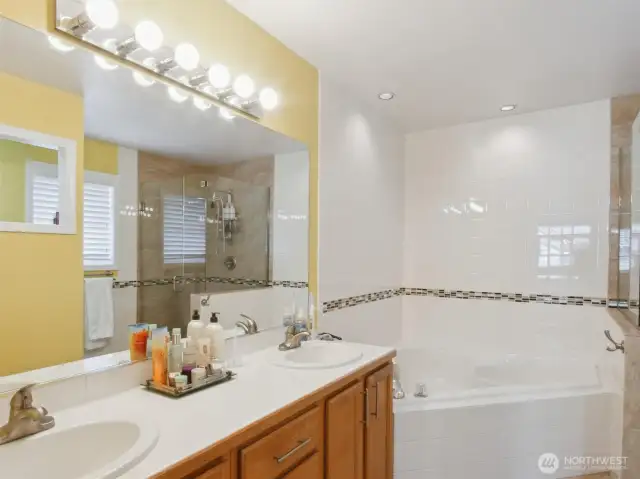 Primary bedroom ensuite features double sinks, a soaking tub, spacious showert, and a toilet with warm water Bidet (in all three bathrooms).