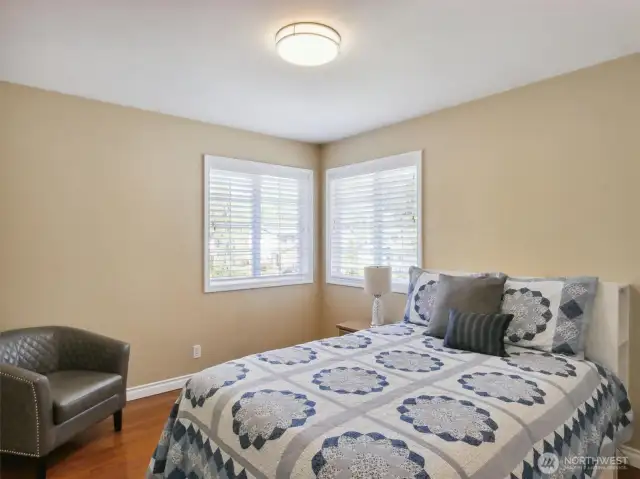 Comfort takes center stage in this unpretentious bedroom, ensuring a restful night's sleep.