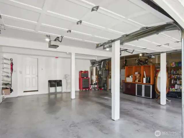 A spacious three-car garage with separate automatic openers, a newer hot water tank, furnace heat pump A/C for year-round comfort,  plus the convenience of a central vacuum system.