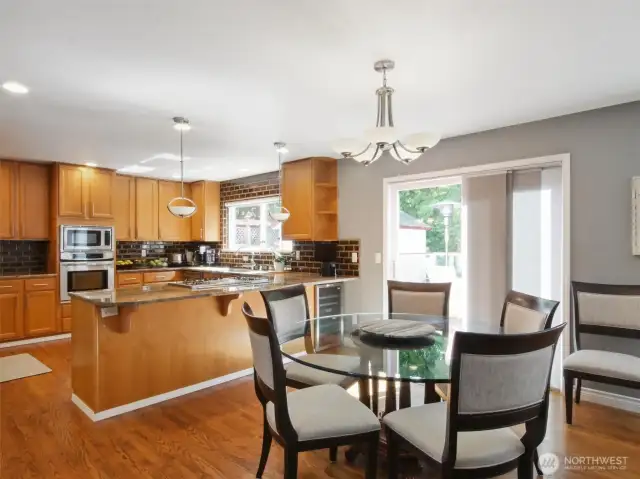 Everyday dining area connects the kitchen to the family room, easy to cook up a meal, serve it up, and dine with loved ones all in one location.