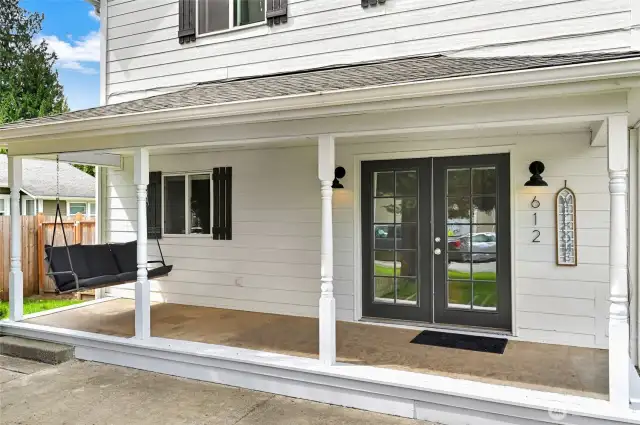 Welcoming front porch with a swing.