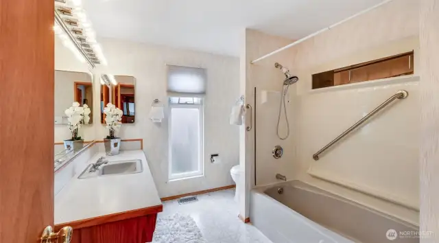 Enjoy the luxury of your spacious en suite full bathroom, featuring a large countertop that offers plenty of room for all your essentials and a touch of elegance