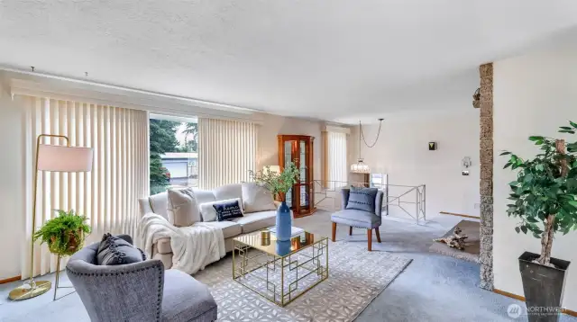 Natural light fills this traditional living room, showcasing an open layout that balances spaciousness with cozy charm for relaxing or entertaining