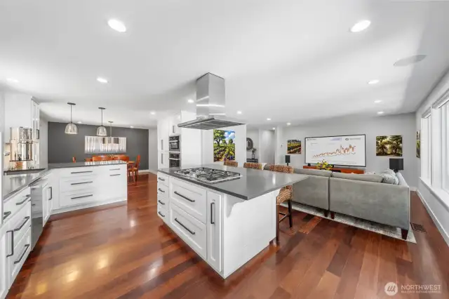 Gleaming Olive wood floors, custom white cabinets, quartz counters......