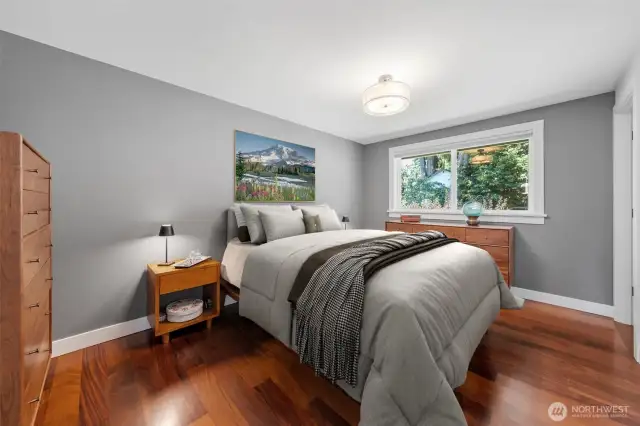 Primary bedroom overlooks the back yard~