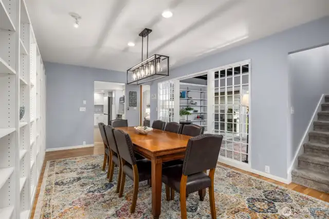 The dining room is adjacent to an additional flex room that can be used in so many ways - a library, additional eating space, or an office.