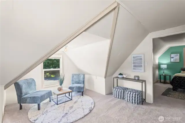 Upstairs you will find this cozy corner nook perfect for catching up on a good book or a work-from-home office space. Complete with brand new carpet and easy access to the primary bedroom.