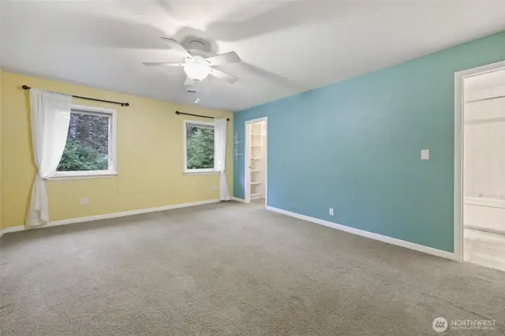 Primary bedroom with walk in closet and full bath