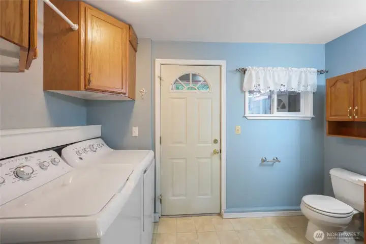 Laundry room and half bath off of the bonus room.  Door leads to back yard patio