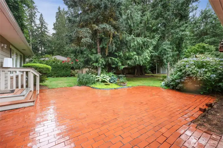 Brick patio in back yard. Located off of the main sliding door or laundry room