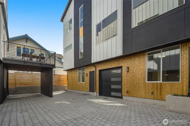 The private drive provides direct garage access while offering a sense of community within this exclusive enclave.
