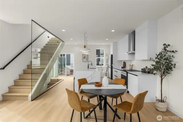 A sculptural staircase adds both drama and design sophistication, bridging each level with elegance.