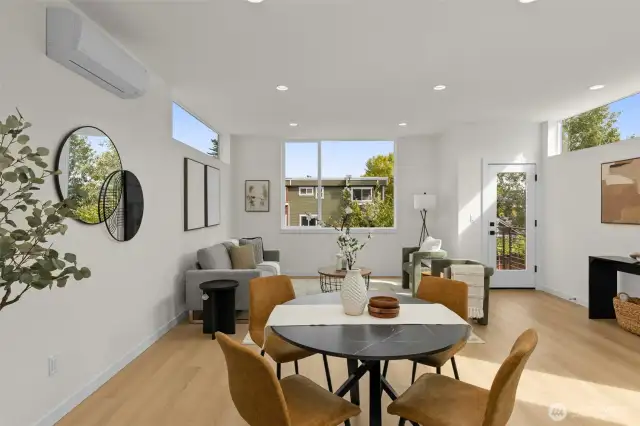 Open-concept living at its finest, where kitchen, dining, and lounge spaces flow together in one harmonious setting.