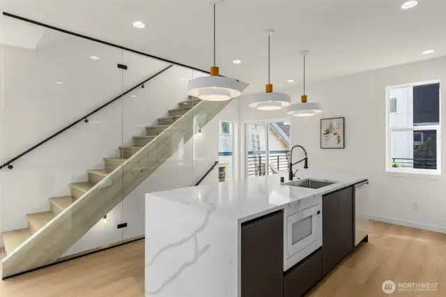 Every detail in this kitchen is considered, from integrated hardware to thoughtful lighting, creating a space that feels timeless and efficient.