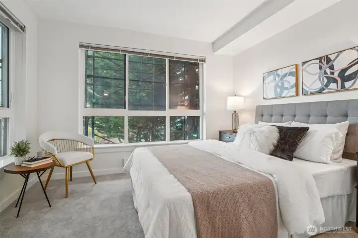 Large windows let gentle northern light flow into the spacious bedroom all year long.