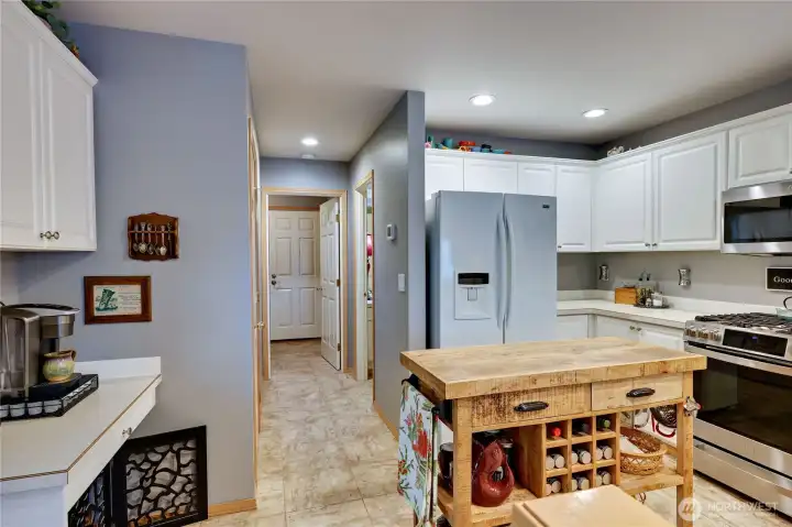 Perfect Coffee station on the left, walk-in pantry is just beyond kitchen on the left.