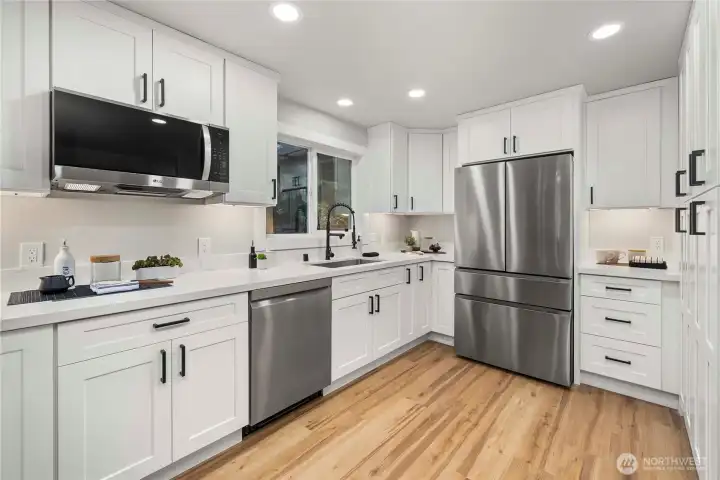 High end shaker cabinets and quartz counters.