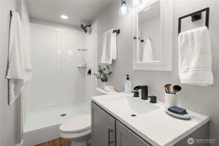 Downstairs bathroom with shower.