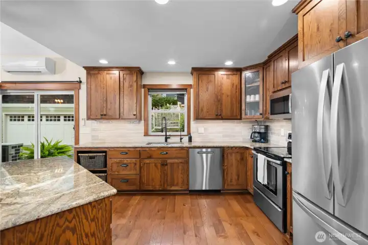 Features granite counters & custom hand-crafted cabinetry.