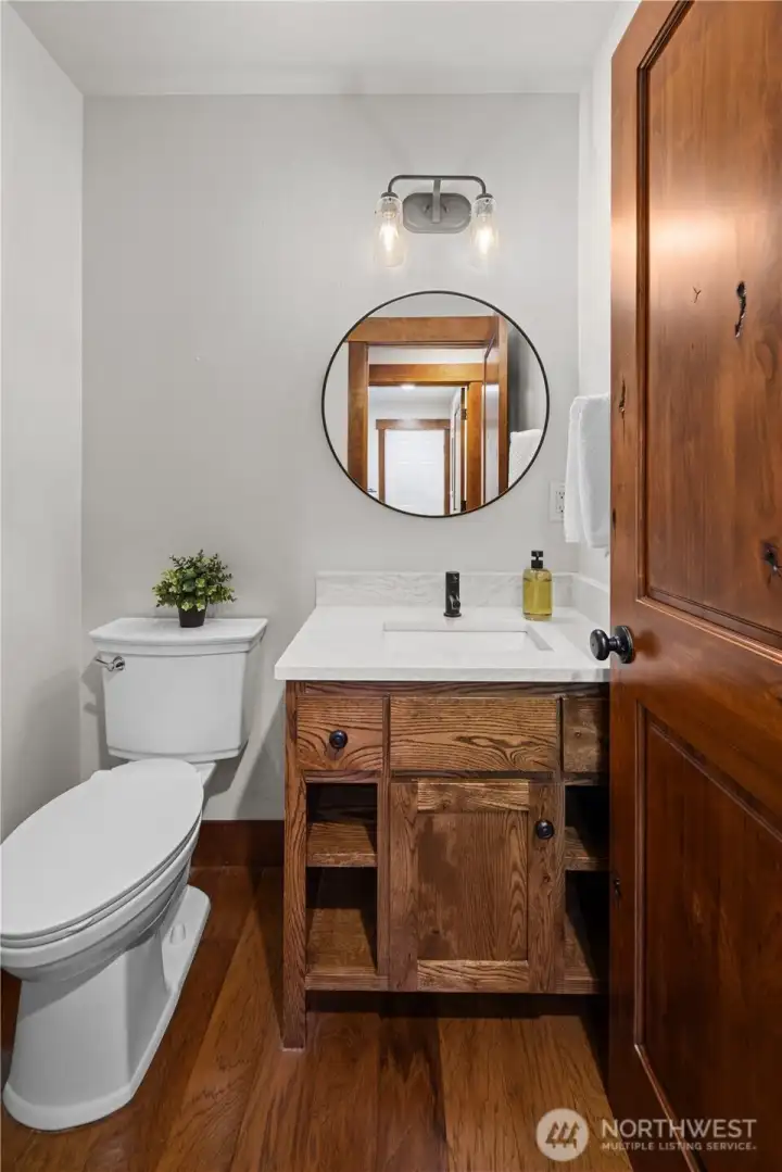 Main-floor powder Bath w/quartz counters, all bathrooms recently upgraded.