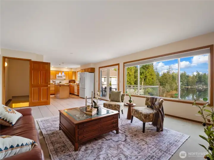There is room for a kitchen table in the kitchen. The French doors lead out to the deck outside.