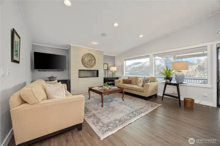 Spacious living with propane gas fireplace.