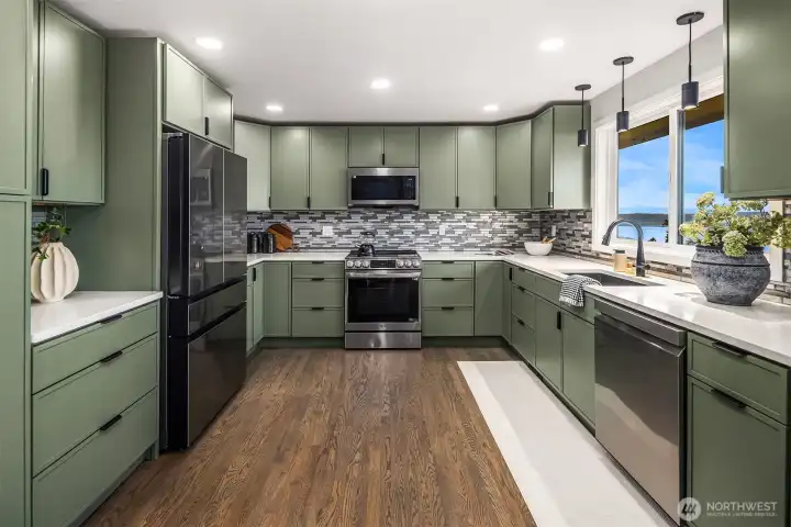 Fully remodeled for aesthetics and functionality, the kitchen is the ideal spot for gathering with friends.