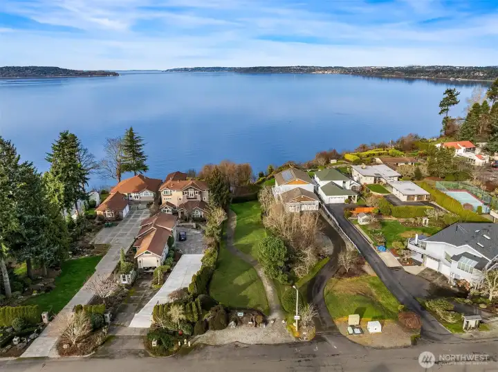 Picinic area and gated entrance to the path/stairs to the beach.