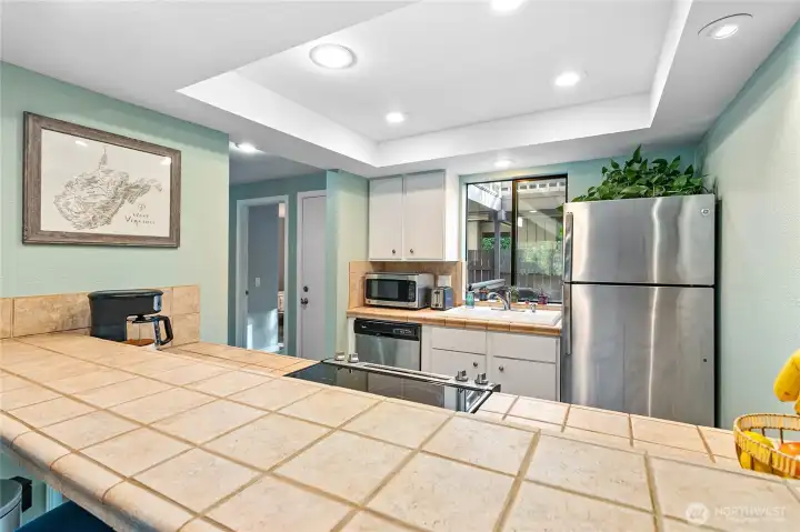 Kitchen with view out the back private deck.