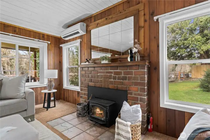 Mirror above stove is a 110 year old antique. Bricks that are in the fireplace surround and the chimney were resourced from City of Seattle in 1910 when they tore out original brick streets and repurposed in this historical home.