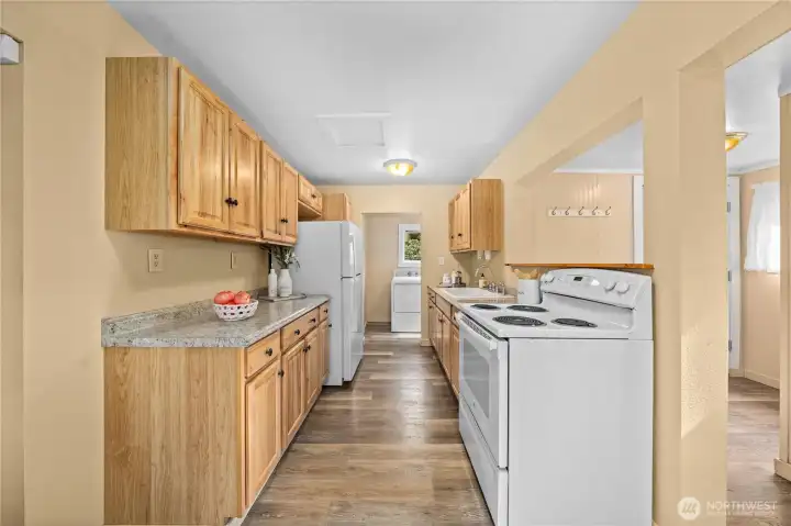 Generous kitchen storage and prep areas make meal time simple.
