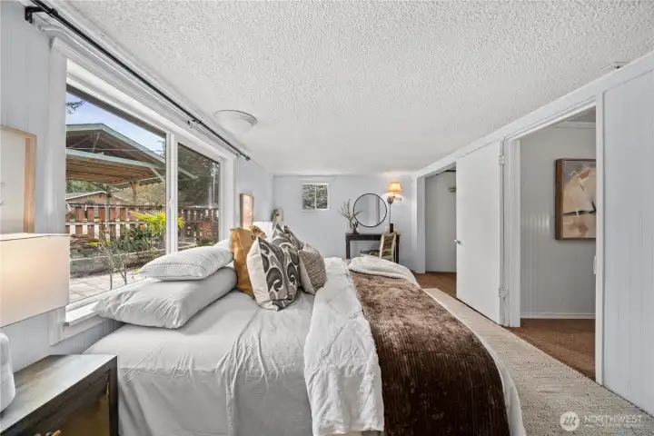 Bright and roomy bedroom with dual closets for ample storage.