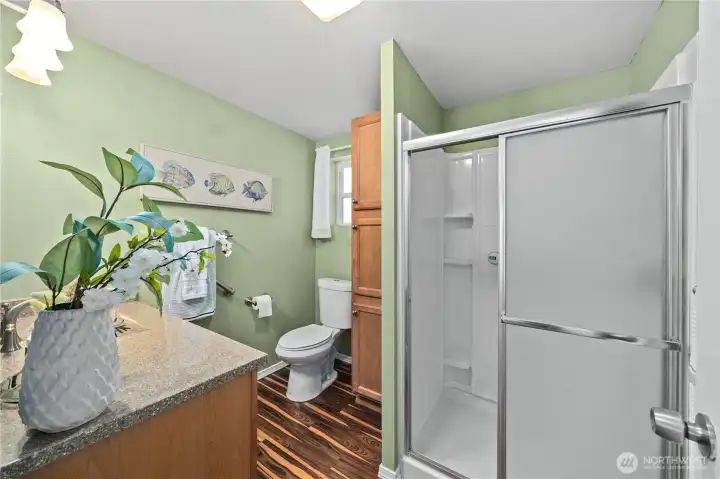 Bathroom designed for comfort and convenience with ample storage.