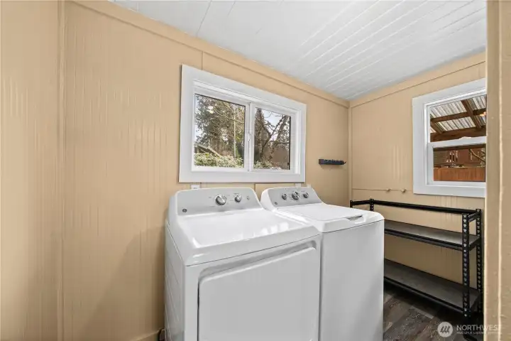 Spacious laundry room with bright natural light.