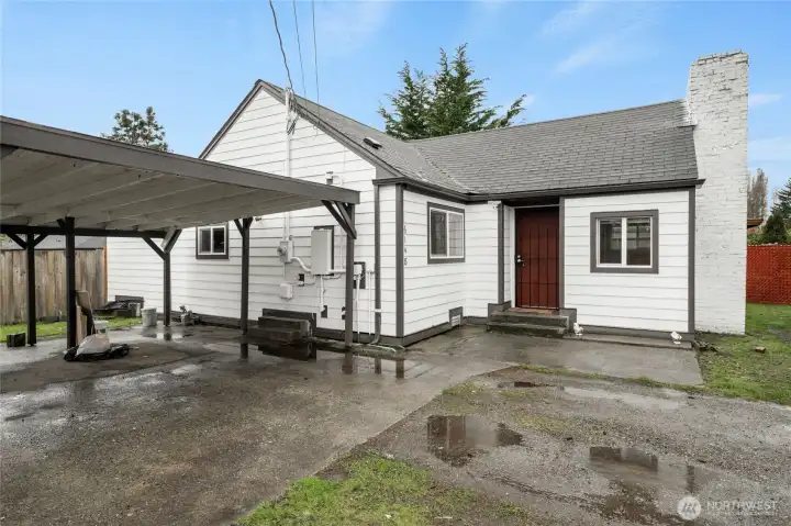 Renovated exterior angle highlighting upgrades and covered carport