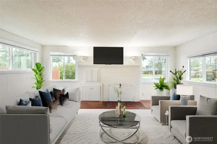 Light filled main living room with expansive windows, creating a bright and inviting atmosphere