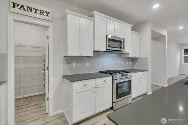 Convenient walk-in pantry perfect for organizing all your essentials.