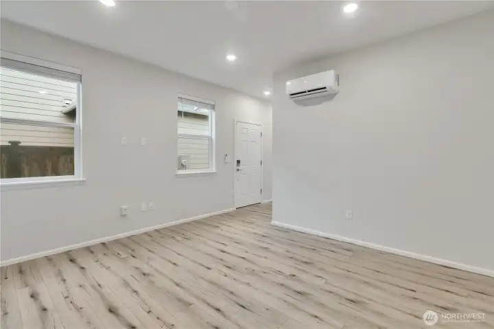 This home boasts a rare main-floor, fully functional mother-in-law suite with a separate private entrance.  This area is the living space.