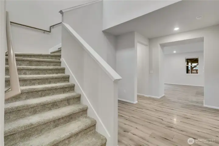 Open and airy staircase leading to the home’s upper level.