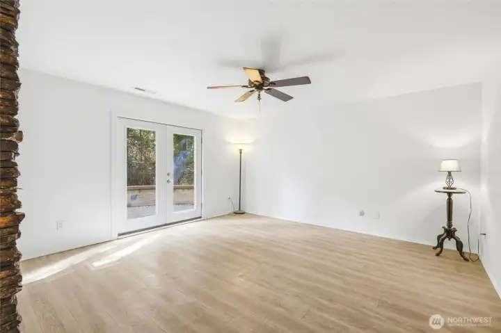 Downstairs rec room with french doors to the paver patio.