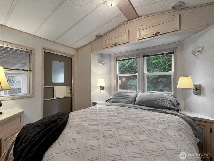 Another view of the primary bedroom showing natural light