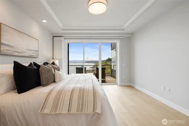 Wake up to stunning Mount Rainier and Sound views from your primary bedroom and private balcony