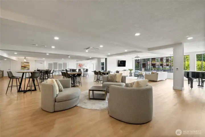 Expansive entertainment lounge featuring a pool table, grand piano, two kitchens, flexible party spaces, multiple seating and dining areas, plus outdoor deck and BBQ area